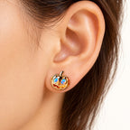 Boucle d'oreille Citrouille Opale portée sur le lobe