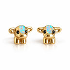 Boucles d'oreilles Vache Opale dorées, la paire sur fond blanc